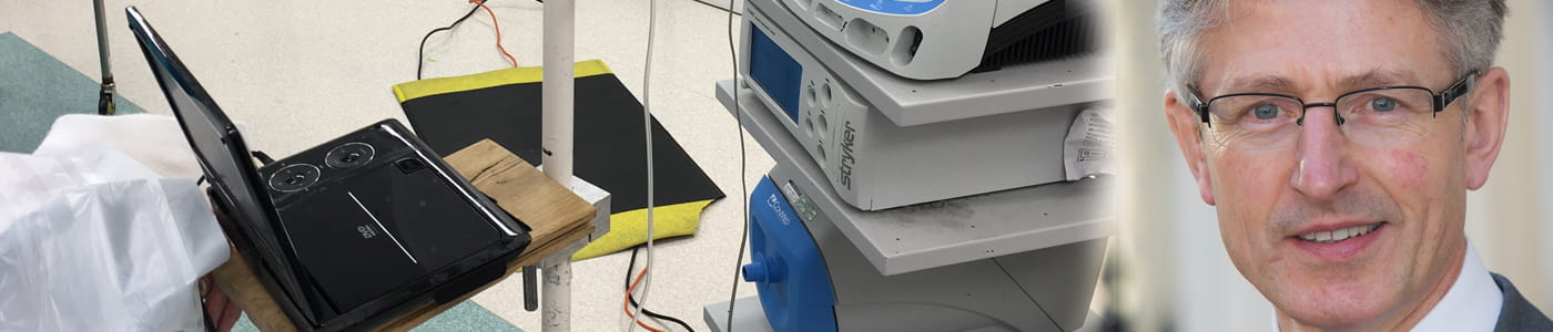 Dr. Richard Griffiths shows the DVD system for surgical patients at Peterborough Hospital that is attached to a clamp on a drip stand.